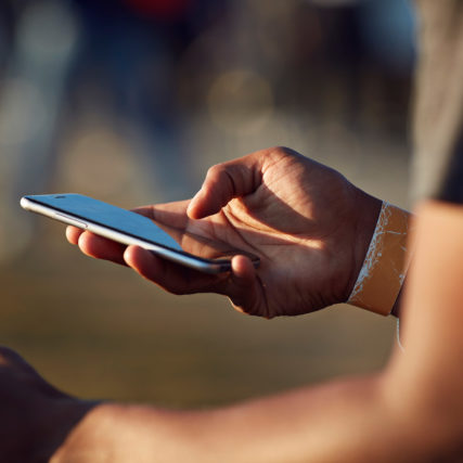 GettyImages-671711967_sm hand holding mobile phone