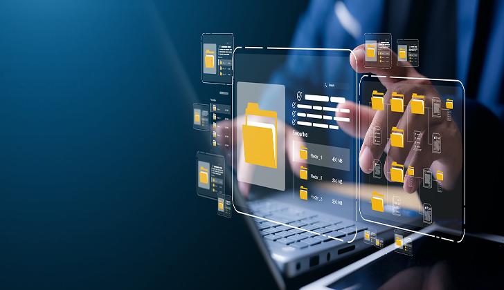 File organization in front of a laptop screen